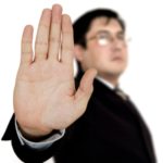 Businessman showing stop