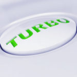 white plastic button with a green caution sign white plastic button with a green caution sign